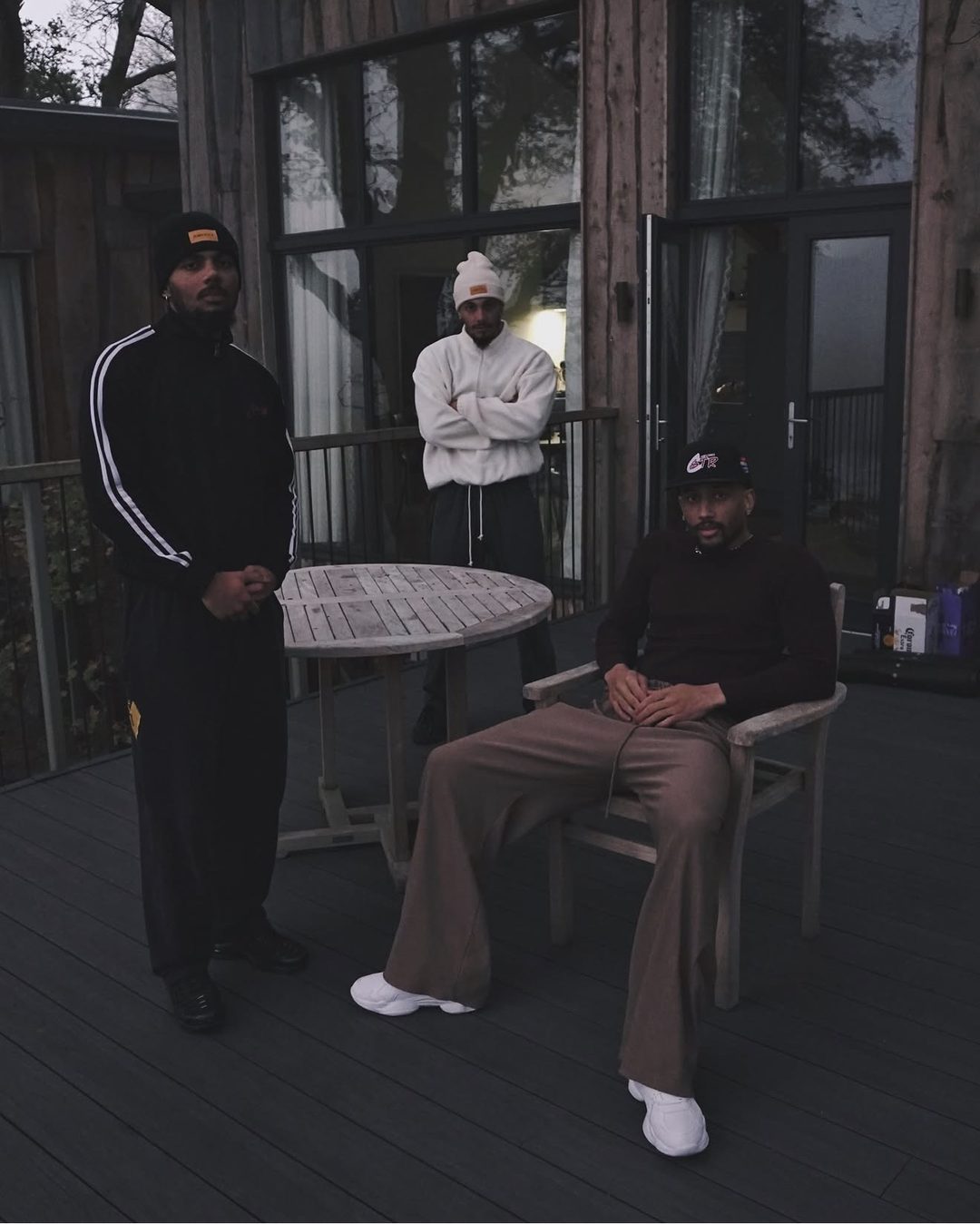 The Fife Brothers on a wooden cabin terrace during a GTTM trip